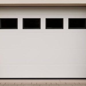 Puerta de garaje automática blanca con ventanas instalada en vivienda en Pontevedra