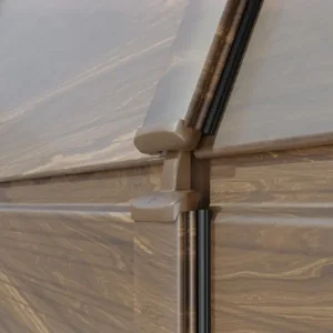 Detalle de bisagra oculta con proteccion antipinzamiento en puerta peatonal integrada